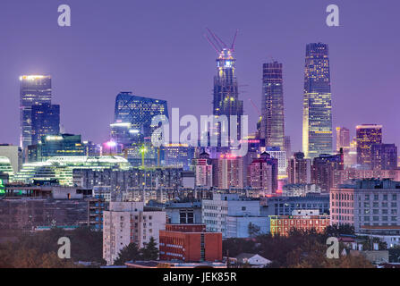 BEIJING-AUG. 8, 2016. Skyscrapers in Beijing at twilight: World Trade Center Tower 3, 330m, China Zun Tower, 528m (under construction). Stock Photo