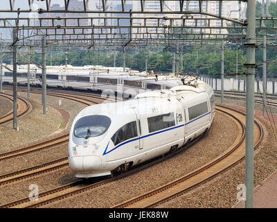 BEIJING-JUNE 5, 2016. Bullet train departs from Beijing. Past 10 years China built 20,000km high-speed rail, 20 urban public transport systems. Stock Photo
