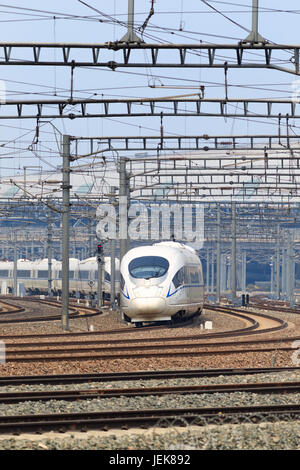 BEIJING-JUNE 5, 2016. Bullet train departs from Beijing South Railway Station. China boasts the world's biggest high-speed railway network. Stock Photo