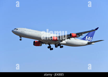 BEIJING-DEC. 9. SAS Airbus A340-313X, LN-RKF landing. Airbus A340 is a long-range four-engine wide-body commercial passenger jet airliner. Stock Photo