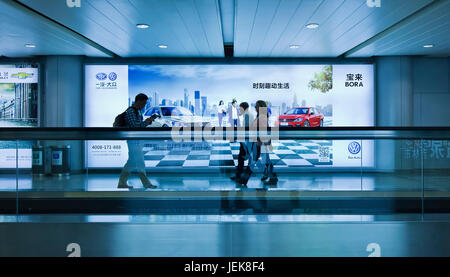 BEIJING-OCT. 4, 2014. VW advertisement Beijing Capital Airport. VW said it planned develop and build new, environmentally-friendly vehicle with FAW. Stock Photo