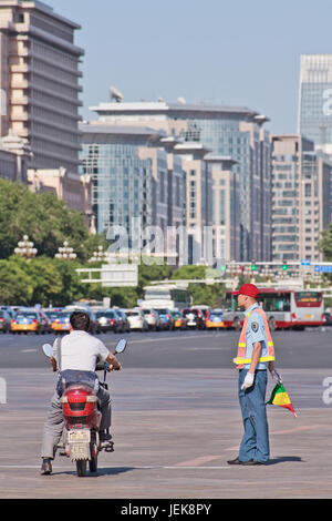 BEIJING-MAY 29, 2013. Traffic controller in city center. Beijing government released action plan improving public transport and encourage cycling. Stock Photo