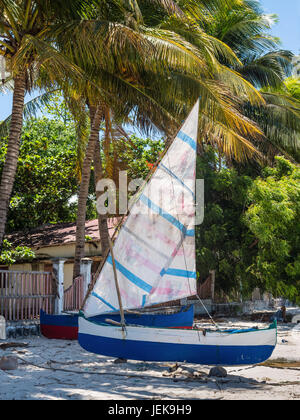 Ramena, Madagascar - December 20, 2015: Traditional Malagasy wooden fishing sail boats on the sea coast, Madagascar. Ramena is a charming, steadily gr Stock Photo