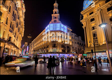 Nanjing East Road at night time. Nanjing Road is the main shopping street of Shanghai, China, and is one of the busiest in the world. Stock Photo