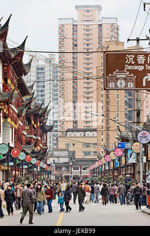 Crowded shopping street on March 29, 2009 in Shanghai. With 23 million citizens Shanghai is China’s largest city by population. Stock Photo