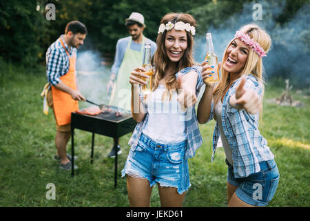 Two beautiful young women having fun while waiting for barbecue Stock Photo