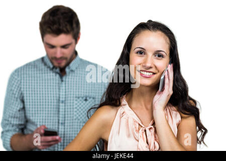 Happy couple using smartphones Stock Photo