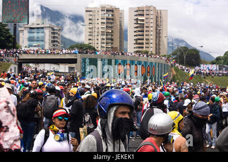 Demonstrators concentrate on a highway during a protest against the government of Nicolas Maduro in Caracas. Stock Photo