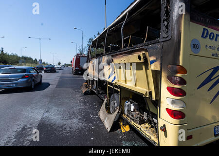 Thessaloniki, Greece - June 25, 2017: A tourist bus got fire and burned completely on the peripheral road of Thessaloniki. Passengers have been taken  Stock Photo