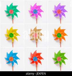 Collage of colorful pinwheels on white paper background Stock Photo