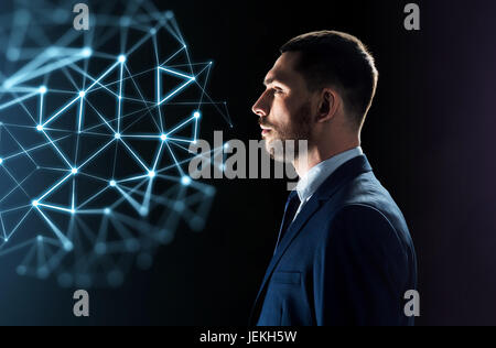 businessman looking at network virtual projection Stock Photo