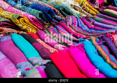 Multi-colored fabrics lie one on another Stock Photo