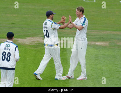 Yorkshire's Steven Patterson (right) celebrates with Jack Brooks after taking the wicket of Surrey's Scott Borthwick during the Specsavers County Championship, Division One match at Headingley, Leeds. PRESS ASSOCIATION Photo. Picture date: Monday June 26, 2017. See PA story CRICKET Yorkshire. Photo credit should read: Anna Gowthorpe/PA Wire. RESTRICTIONS: Editorial use only. No commercial use without prior written consent of the ECB. Still image use only. No moving images to emulate broadcast. No removing or obscuring of sponsor logos. Stock Photo