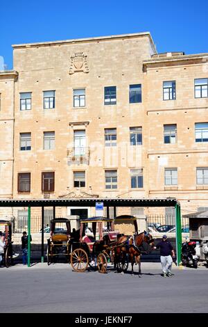 Horse drawn carriages in front of the Public Registry building, Valletta, Malta, Europe. Stock Photo