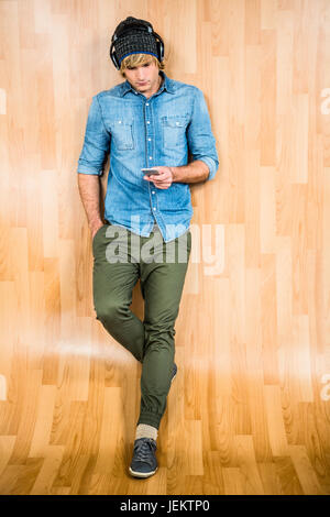Focused hipster listening to music Stock Photo