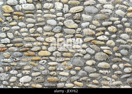 Walking path lined with stones Stock Photo