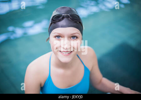 Pretty woman getting in the water Stock Photo