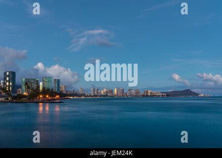 A skyline view of Diamond Head and Ala Moana at dusk. Stock Photo