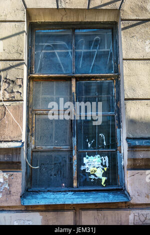 ST. PETERSBURG, RUSSIA - JULY 16, 2016: The window of an abandoned apartment building Stock Photo