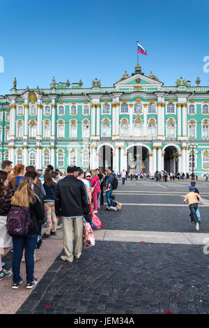 ST. PETERSBURG, RUSSIA - JULY 12, 2016: Tourists stand in queue long hours in the State Hermitage Museum, St. Petersburg, Russia Stock Photo