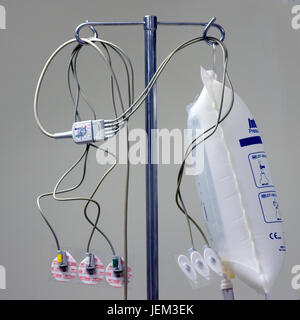 An IV pole or drip stand in an anaesthetics room in readiness for use anaethsetising a patient for a surgical operation. Stock Photo