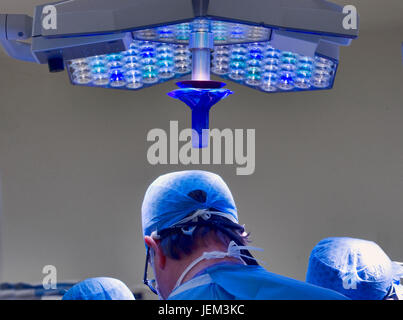 Surgical team work using cool directional lighting