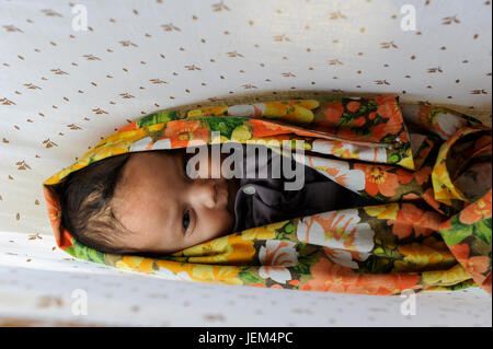 Bangladesh, Region Madhupur, village Idilpur, Garo Baby in cradle, Garo is an ethnic group and christian minority Stock Photo