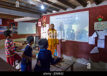 Lolei, Cambodia - January 04, 2017: A classroom in the rural Lolei village during an english lesson. The teaching is carried out by monks Stock Photo