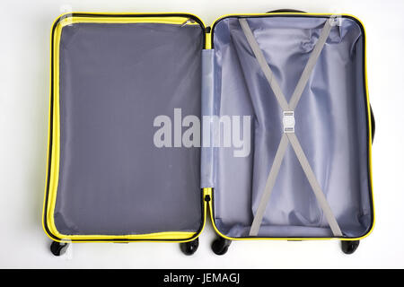 Opened empty traveler suitcase. Large bag for travelling, white background. Stock Photo