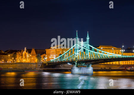 BUDAPEST, HUNGARY - FEBRUARY 22, 2016: Night view of Liberty Bridge - Freedom Bridge in Budapest, Hungary, connects Buda and Pest across the River Dan Stock Photo