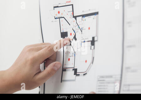 The architect studies the drawing of the new apartment Stock Photo