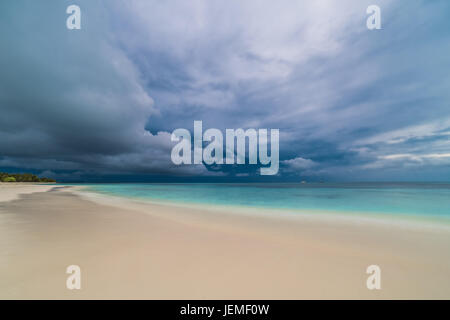 Moody sky and beach, long exposure. Abstract beach background. Dramatic waves and sky Stock Photo