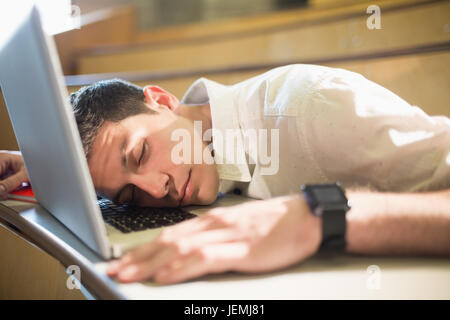 Male student falling asleep during class Stock Photo