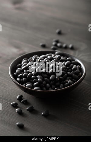 black turtle beans legumes in bowls Stock Photo