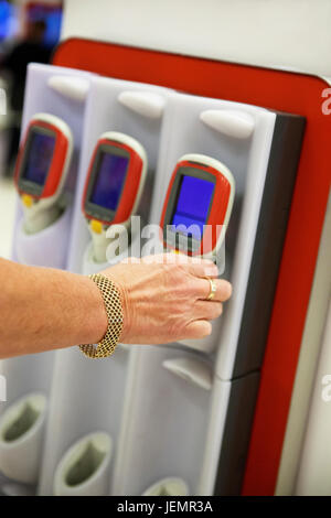 Hand holding barcode reader Stock Photo