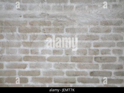 The background of the plastered wall. Plastered brick wall with white silhouettes of bricks. Stock Photo