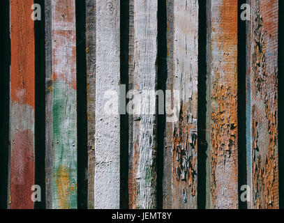 Bright wooden background from colored vertical boards with peeling paint Stock Photo