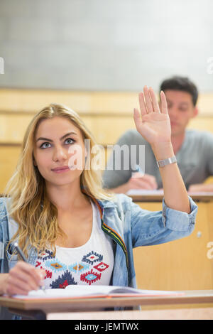 Student listening attentively during lecture in the classroom Stock