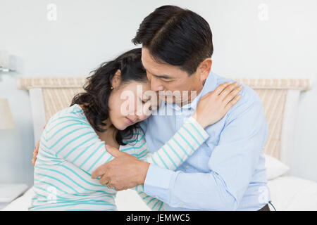 Sad couple embracing Stock Photo