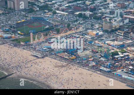 New York, USA. 25th Jun, 2017. Aerial photo of Coney Island beach and amusement park. Beach and park were crowded in the first Sunday of summer 2017 Credit: Eric Pasqualli/Alamy Live News Stock Photo