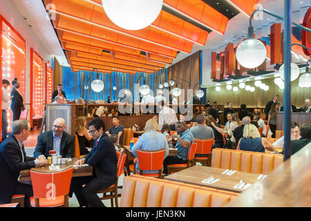 New York, USA. 26th June, 2017. Patrons at the ceremonial opening of the second Times Square branch of Junior's Restaurant. in the former Ruby Foo's space, on Monday, June 26, 2017. The original Junior's is located in Downtown Brooklyn and is beloved for it's famous cheesecake. Junior's has opened a second space in Times Square in the now closed Ruby Foo's location. The new restaurant seats 300 people. ( © Richard B. Levine) Credit: Richard Levine/Alamy Live News