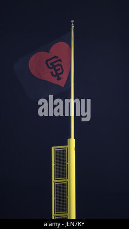 San Francisco, California, USA. 26th June, 2017. San Francisco raises the victory flag for the Giants 9-2 victory over the Colorado Rockies on LGBT Night at AT&T Park in San Francisco, California. Valerie Shoaps/CSM/Alamy Live News Stock Photo