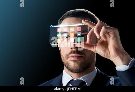 businessman with transparent smartphone Stock Photo