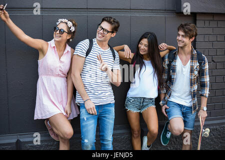 Hip friends taking selfie Stock Photo