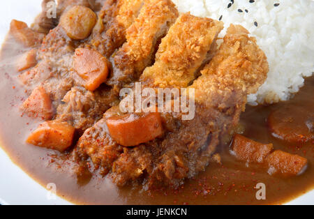 Rice with deep fried pork and curry in Japanese style or katsu kare in white  plate ready to eat. Stock Photo