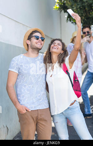 Hip couple taking selfie Stock Photo