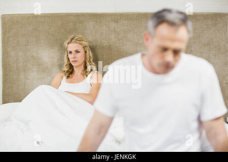 Upset couple sulking each other Stock Photo