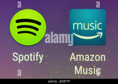 A closeup of the Spotify and Amazon Music apps on a smartphone screen Stock Photo
