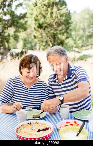 Mature couple having meal outdoor Stock Photo