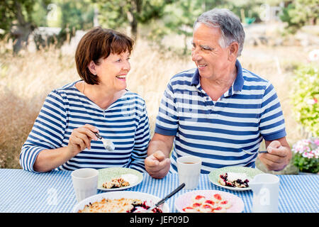 Mature couple having meal outdoor Stock Photo